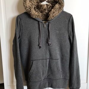 PINK faux fur lined sweatshirt with sequins.